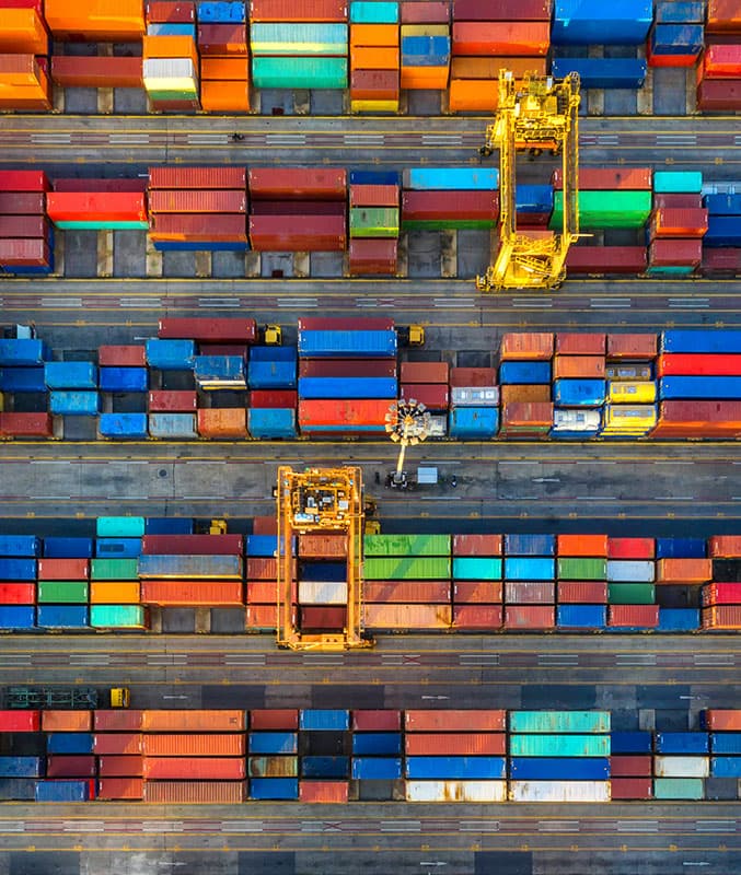 Container ship shipping cargo to harbour by crane; warehouse worker inspecting goods package shelf in storage for supply logistics